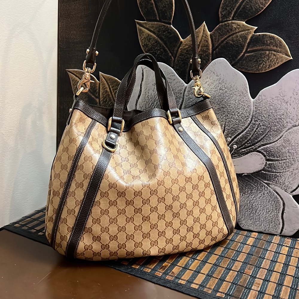 100% Authentic Gucci coated canvas shoulder bag.